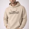 Man wearing beige Ruffus Hoodie. With black printed logo bran don the centre chest